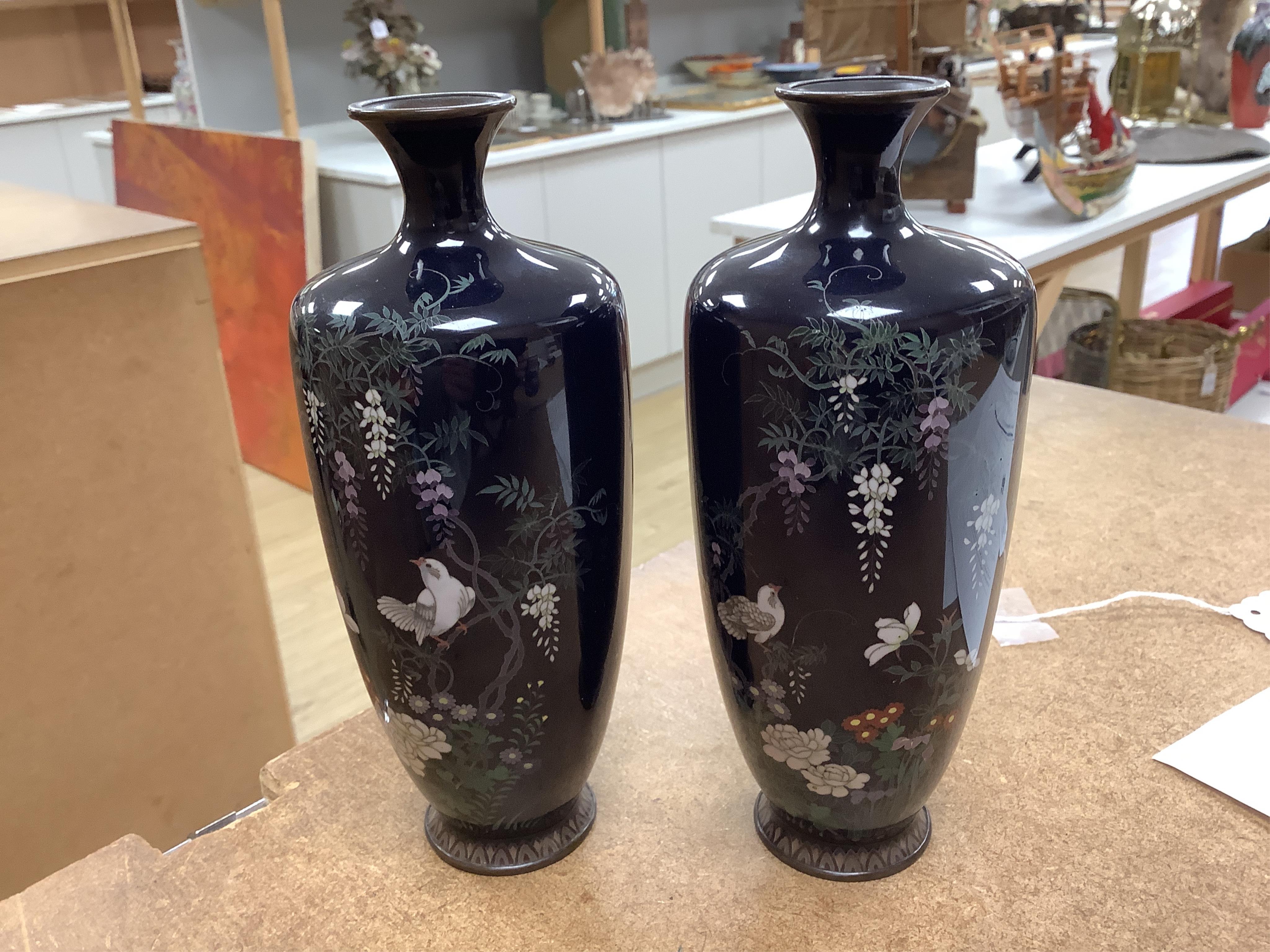 A pair of Japanese silver wire cloisonné enamel vases, Meiji period, wood stands, 18cm high